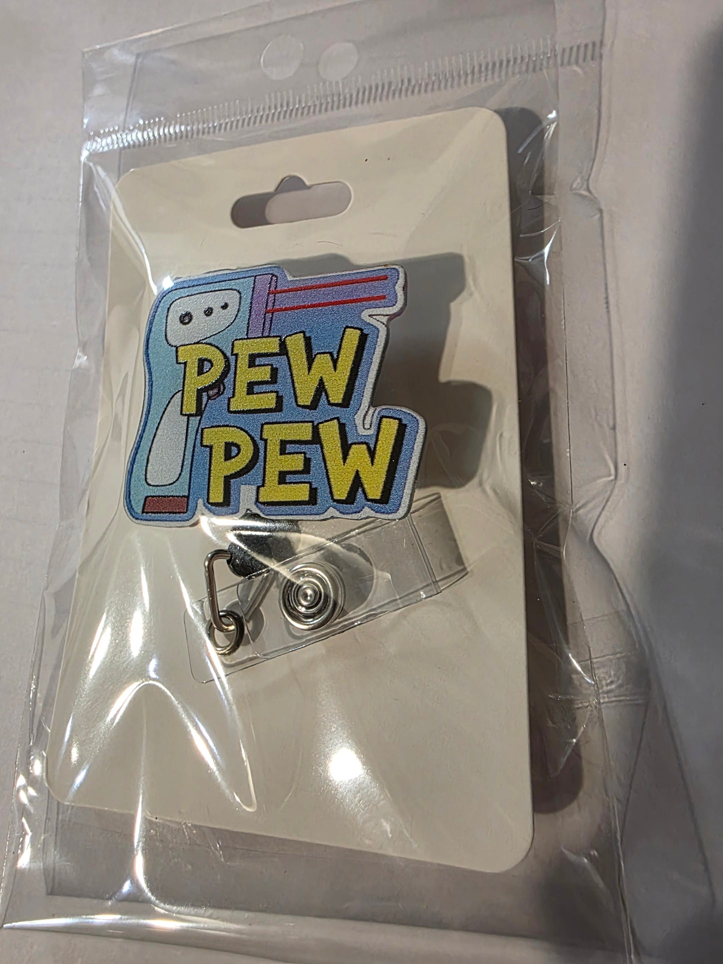 Pew Pew Thermometer Badge Reel