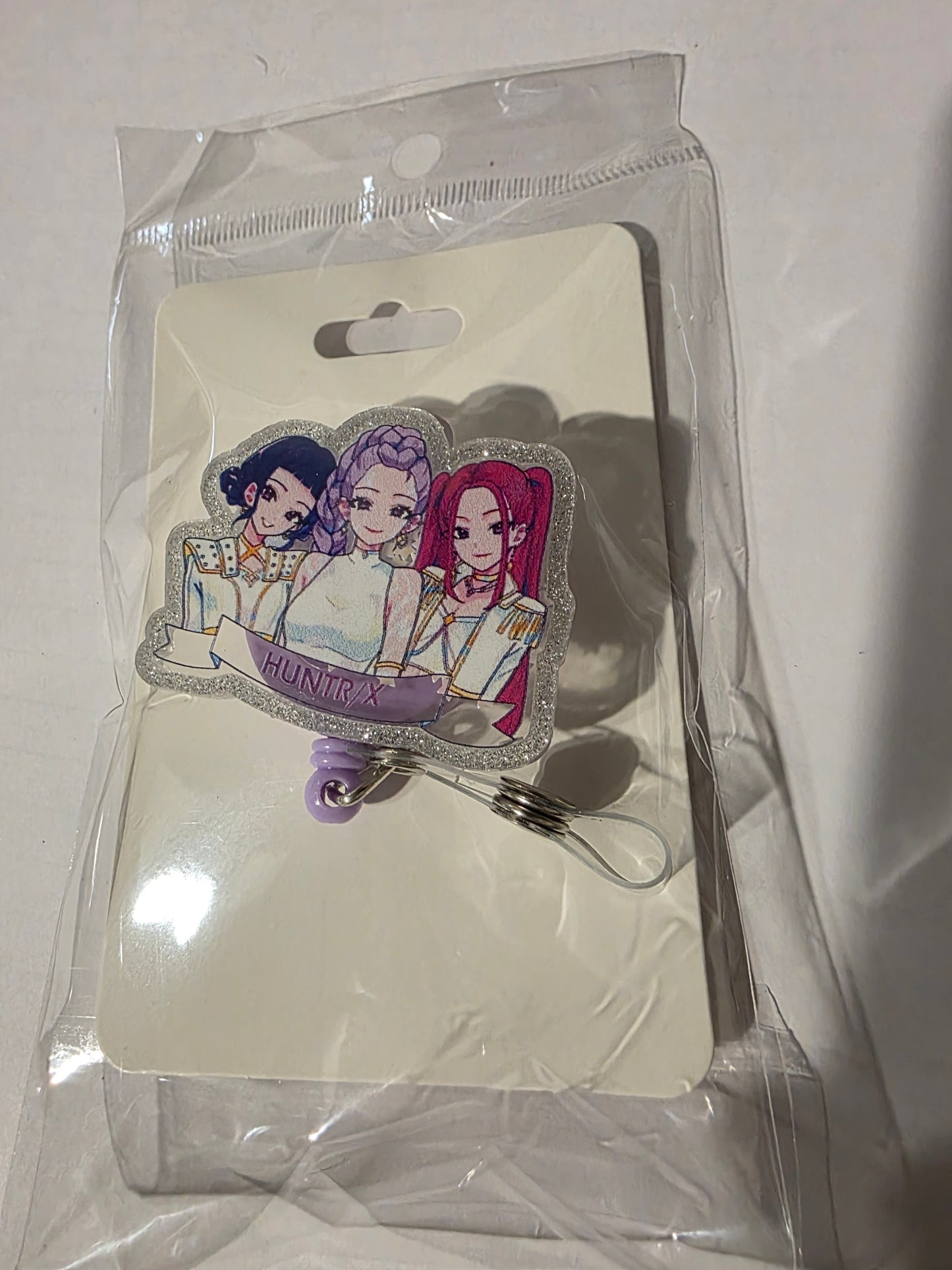Huntr/X Badge Reel
