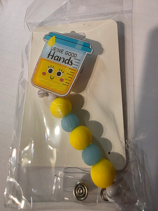 Urine in Good Hands Badge Reel